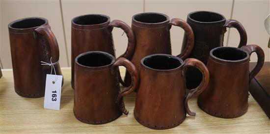 Seven leather tankards